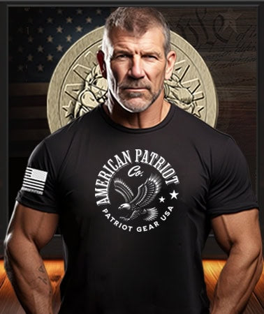 American Patriot Man wearing a black Patriot Gear USA  t-shirt with 'American Patriot Company' text in front of an American flag and American Outfitters Patriot Apparel logo.