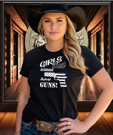American Patriot Woman wearing a Patriot Gear USA Apparel black t-shirt with text and graphics, standing in a rustic setting.