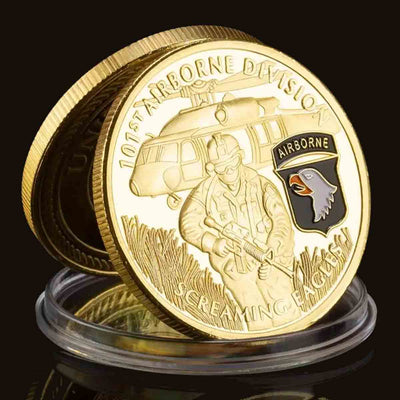 101st Airborne Division "Screaming Eagles" Challenge Coin. High-quality Golden plating for a stunning shine and durability. Intricate design featuring the 101st Airborne Screaming Eagles. Comes in a protective plastic case to preserve its beauty and value. Patriot Gear USA