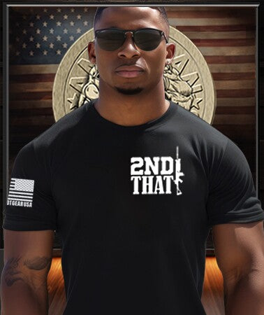 American Patriot Man wearing a Patriot Gear USA Apparel Company black t-shirt with '2nd That' text, sunglasses, and an American flag sleeve patch in front of a Patriot Gear Apparel Company logo on USA flag Background.