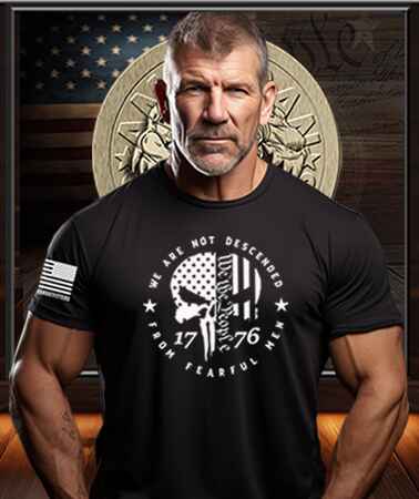 American Patriot Man wearing a black Patriot Gear USA  t-shirt with 'We the People' text in front of an American flag and American Outfitters Patriot Apparel logo.