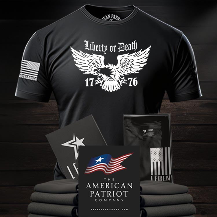 Patriot Apparel Black t-shirt with 'Liberty or Death' design on a wooden surface with Patriot gear USA Logo.
